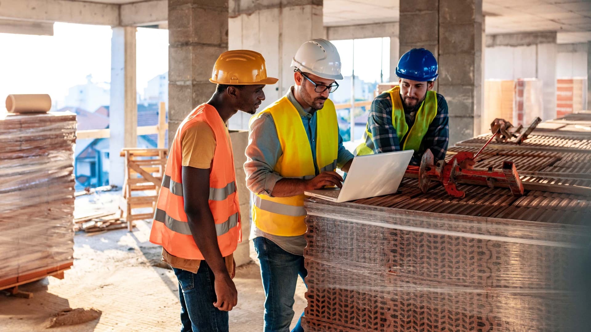 Civil engineers collaborating on an industrial construction site
